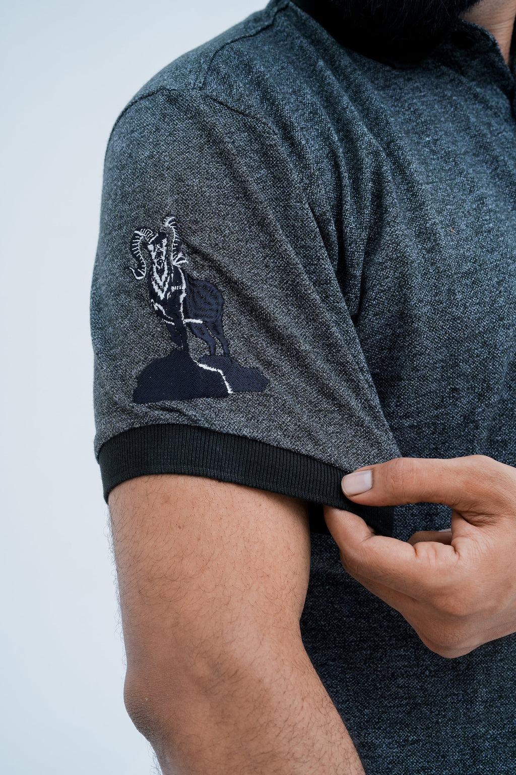 Onyx Contrast Polo - sleeve emblem detail